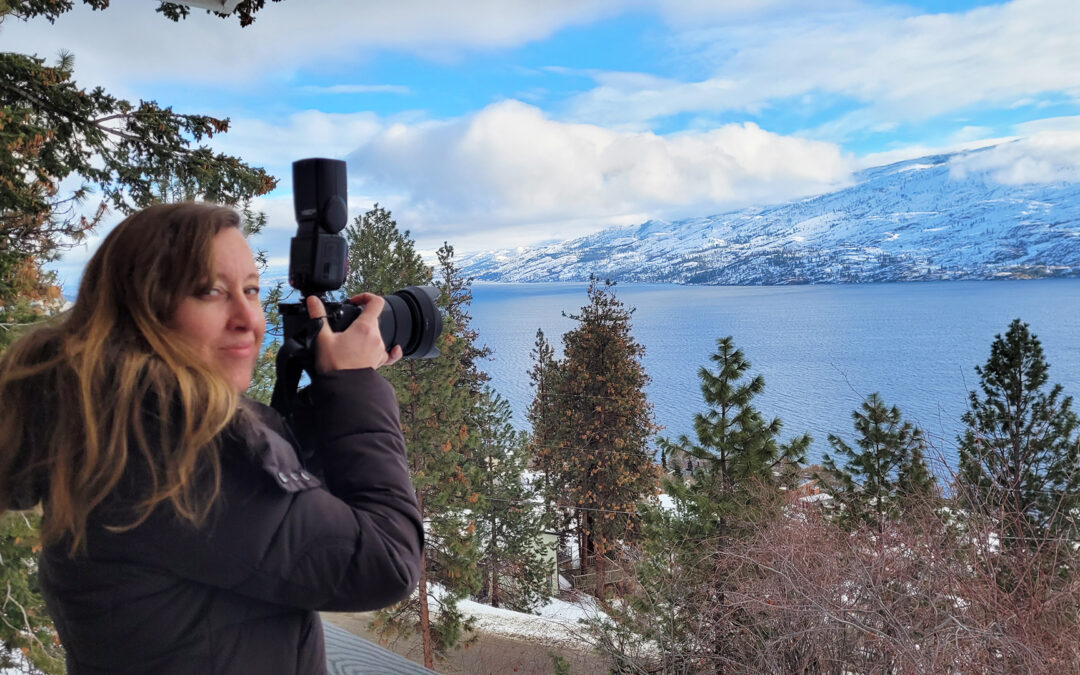 Angela Provost with her Nikon Camera in Peachland BC looking over Okanagan Lake
